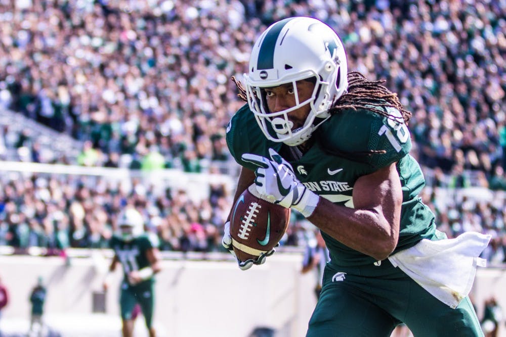 Senior wide receiver Felton Davis III (18) runs upfield during the game against Central Michigan on Sept. 29, 2018 at Spartan Stadium. The Spartans defeated the Chippewas, 31-20.