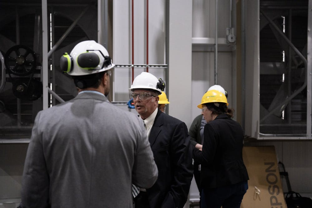 <p>University administrators meet Consumers Energy executives at MSU's Simon Power Plant at a media event on March 20th, 2023.</p>