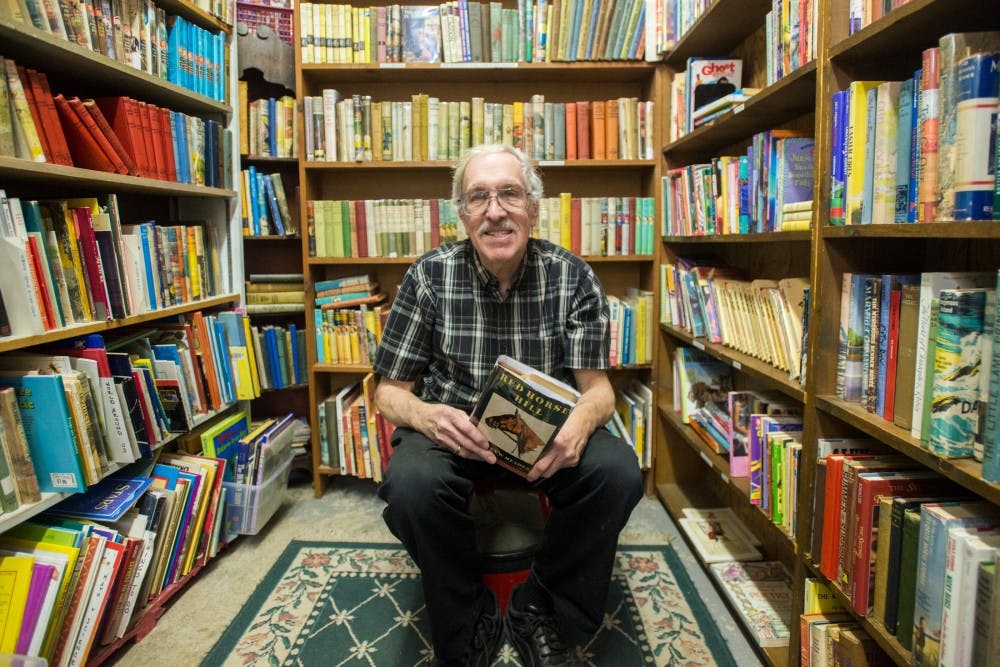 Lansing resident Ray Walsh poses for a portrait on Feb. 20, 2017 at Curious Book Shop at 307 E. Grand River Ave in East Lansing. Walsh is the owner of the Curious Book Shop which has been in its location for more than forty years. 