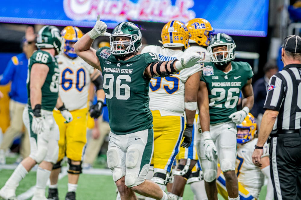 <p>Redshirt senior defensive end Jacob Panasiuk celebrates a sack, during the Spartans&#x27; 31-21 victory against Pitt in the Chick-Fil-A Peach Bowl on Dec. 30, 2021.</p>