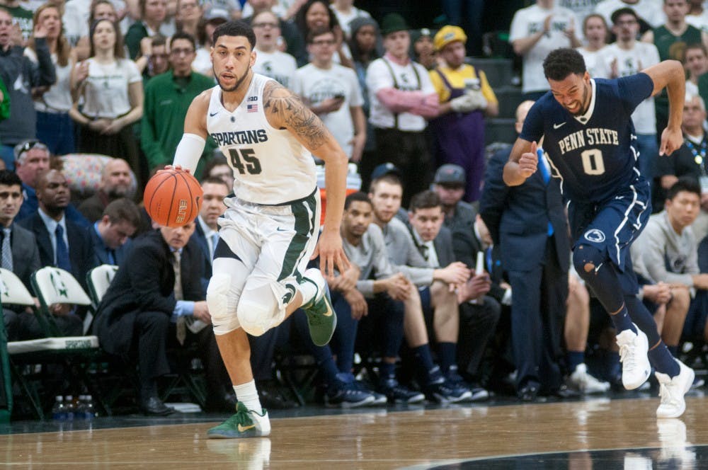 Senior guard Denzel Valentine dribbles ball past Penn State forward Payton Banks during the second half of the game on Feb. 28, 2016 at the Breslin Center.  The Spartans defeated the Nittany Lions 88-57. 