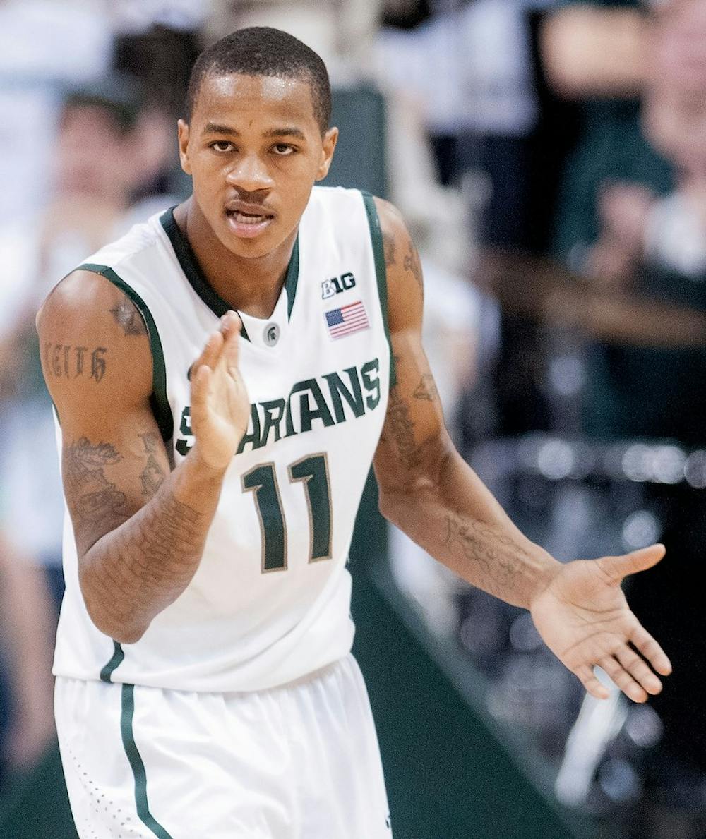 	<p>Junior guard Keith Appling claps his hands to celebrate his shot in the second half of the game. He scored 24 points in this game. The Spartans defeated the Fighting Illini,, 80-75, Thursday, Jan. 31, 2013, at Breslin Center. Justin Wan/The State News</p>