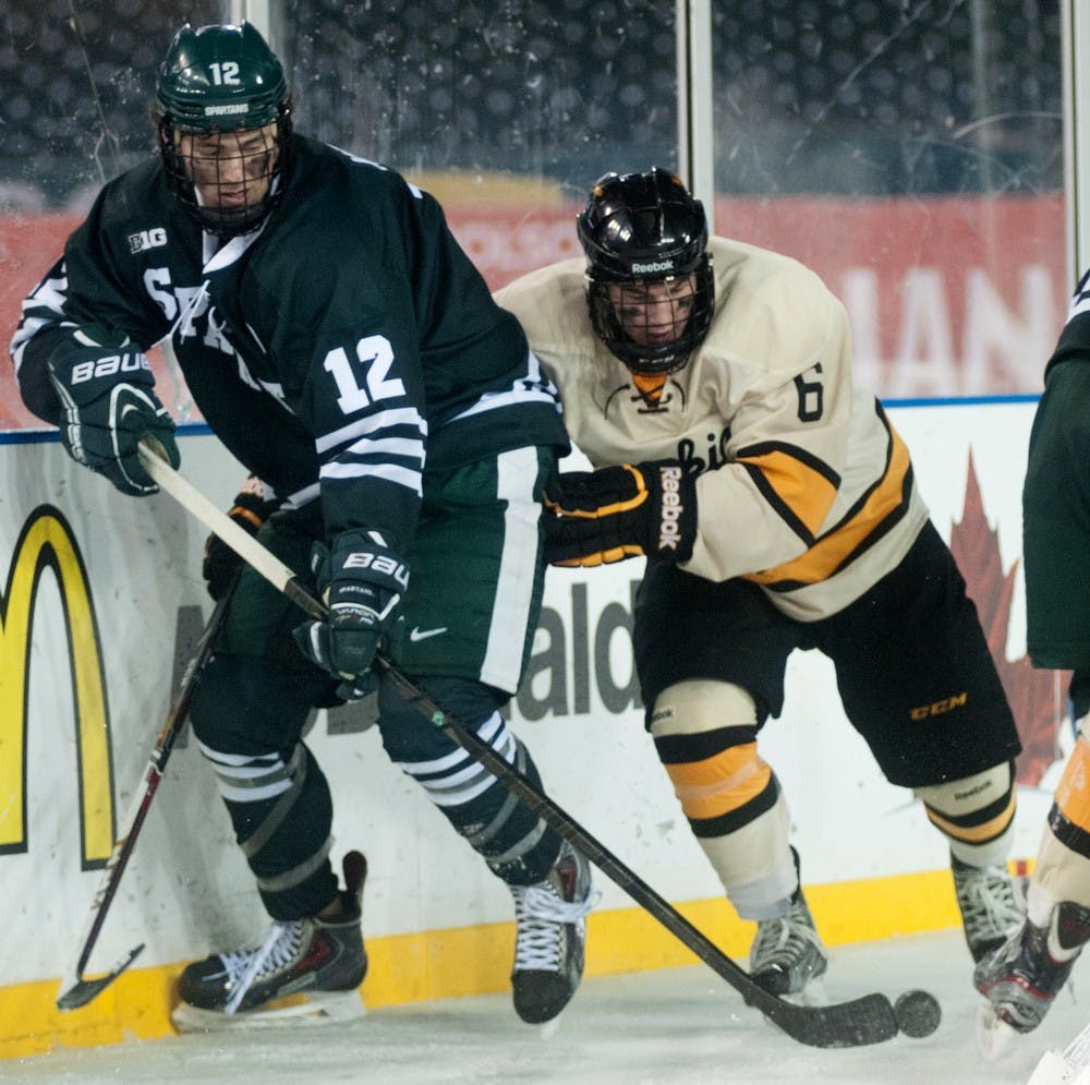 	<p>Sophomore forward Ryan Keller and Michigan Tech defenseman Chris Leibinger fight for the puck Dec. 27, 2013, at Comerica Park in Detroit for the 49th annual Great Lakes Invitational. The Spartans officially tied Michigan Tech 2-2, but with the shootout loss, they will play in the consolation game tomorrow at 3:30 p.m. Julia Nagy/The State News</p>