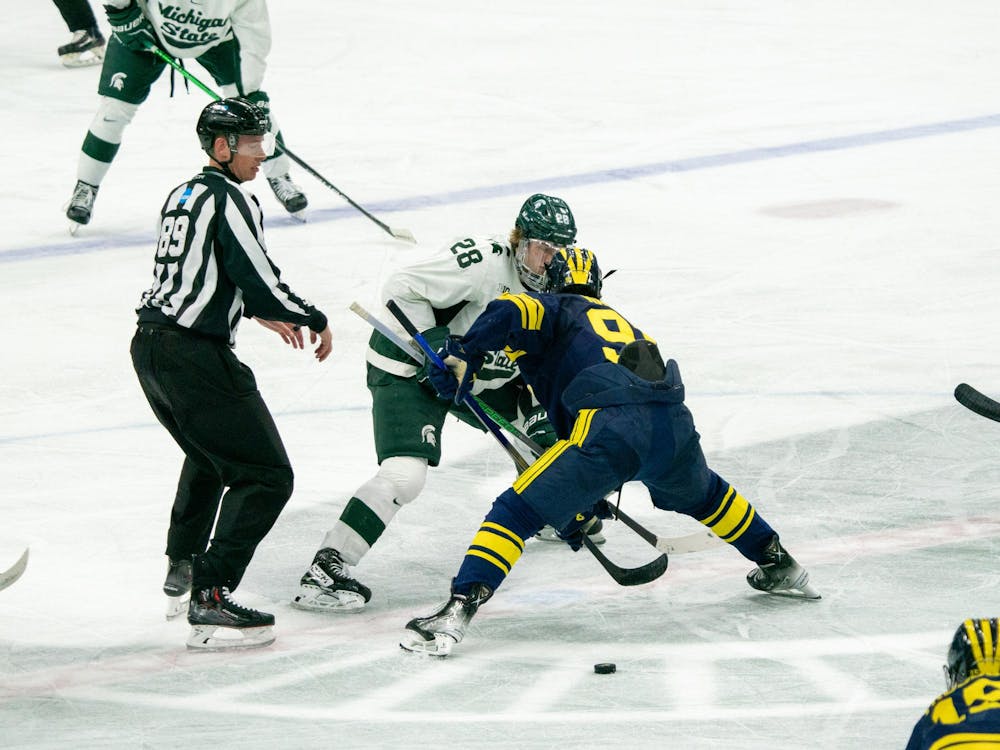 <p>Sophomore forward Karsen Dorwart (28) facing off during a game against University of Michigan at Munn Ice Arena on March 23, 2024.</p>