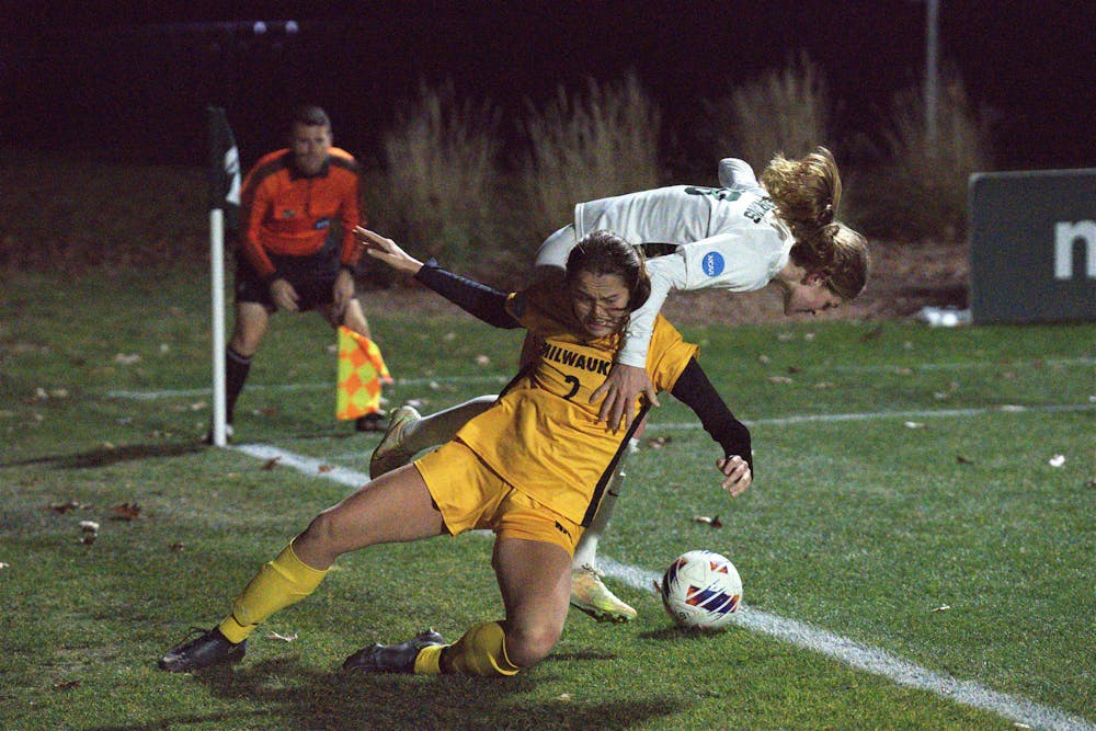 <p>Milwaukee Panther Clara Broecker fights for the ball against the Spartans during the playoff game on Nov. 11, 2022﻿. The Spartans won 3-2 in double overtime. </p>