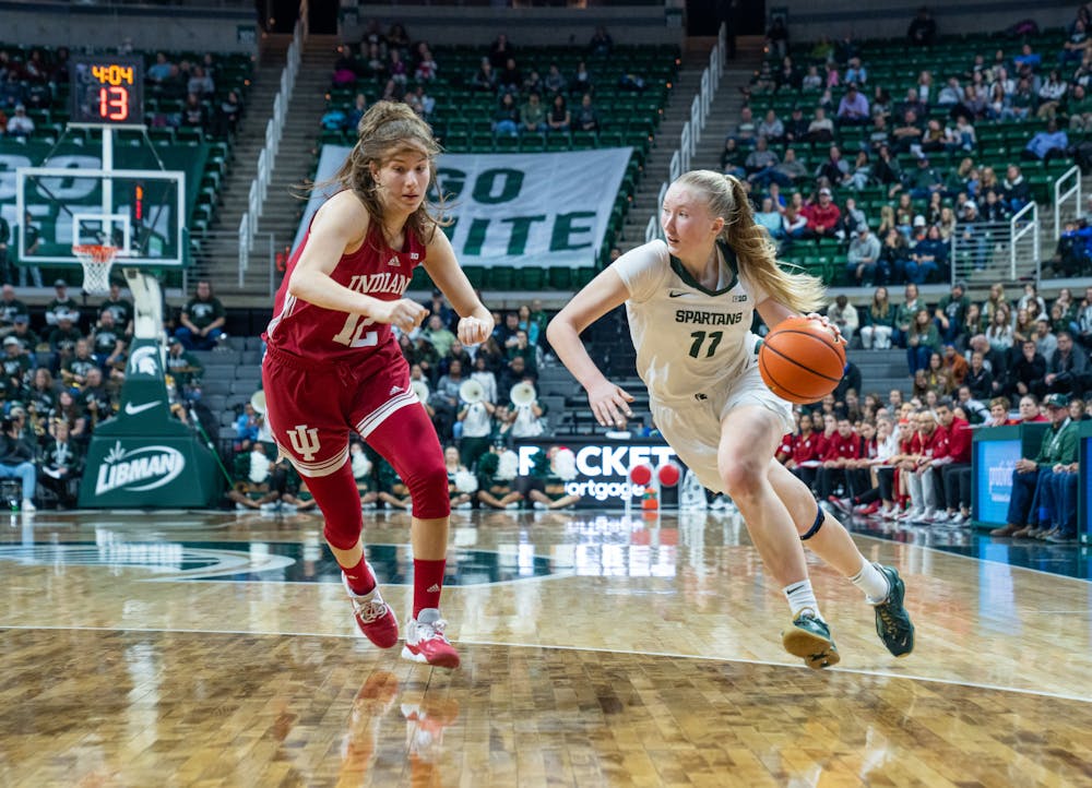 Michigan State guard Matilda Ekh (11) defends the ball against Indiana guard Yarden Garzon (12) during the Spartants victory over the Hoosiers on Dec. 29, 2022.