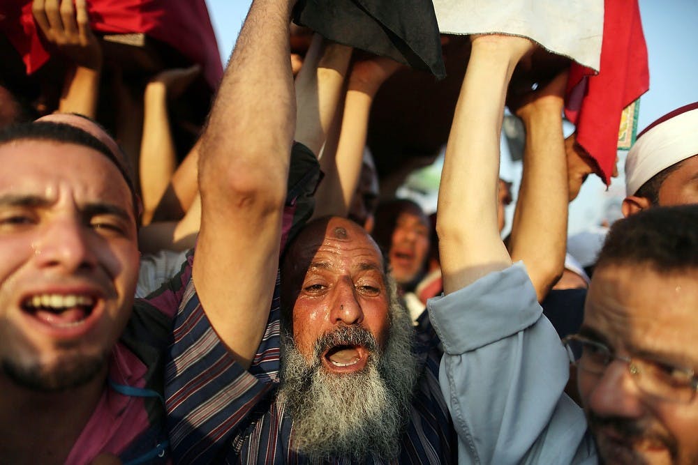 	<p>Supporters of ousted Egyptian President Mohamed Morsi carry the coffins of people killed a day before during the clashes outside the Republican Guard headquarters in Cairo, Egypt, on Saturday, July 6, 2013. (Wissam Nassar/Xinhua/Zuma Press/MCT)</p>