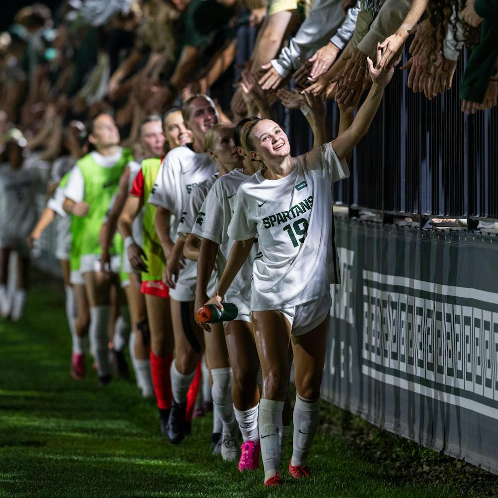 <p>The Michigan State women's soccer team high fives all of the fans in the stands after their season opening game against Xavier University in DeMartin Stadium in East Lansing, Mich., on Aug. 12, 2026.</p>