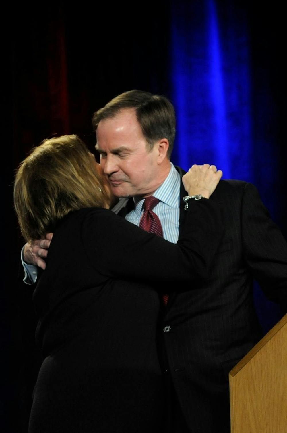 <p>Attorney General Bill Schuette and wife Cynthia Grebe Schuette embrace during his election speech Nov. 4, 2014, at the Detroit Marriott at the Renaissance Center in Detroit, Mich. Schuette was re-elected as Attorney General. Jessalyn Tamez/The State News</p>