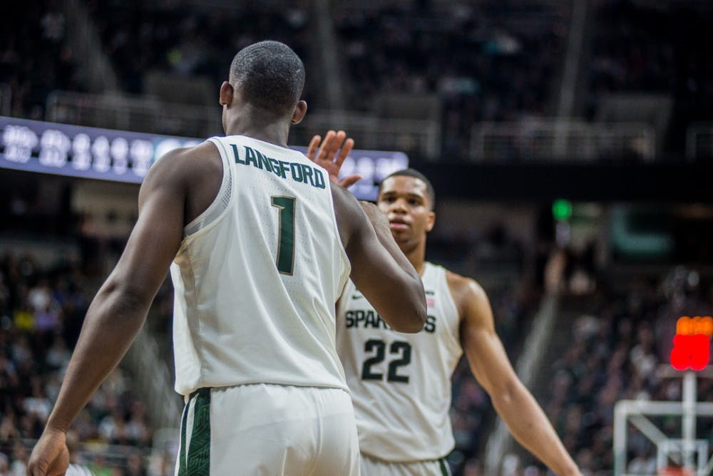 <p>Sophomore guard Miles Bridges (22) high fives sophomore guard Joshua Langford (1) l during the game against Penn State on Jan. 31, 2018 at Breslin Center. The Spartans beat the Nittany Lions 76-68.&nbsp;</p>