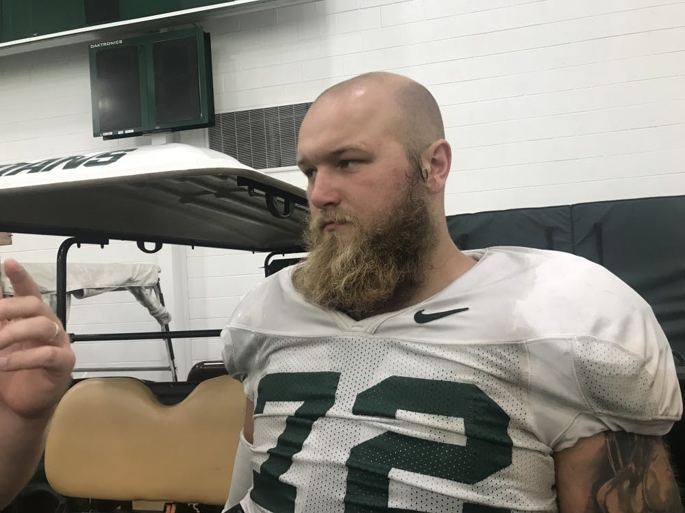 Senior defensive tackle Mike Panasiuk speaks to the press after a practice on Aug. 28, 2019. 