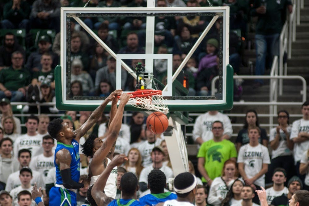 Freshman forward Nick Ward (44) dunks the ball during a game against Florida Gulf Coast on Nov. 20, 2016 at Breslin Center. The Spartans defeated the Eagles, 78-77. 