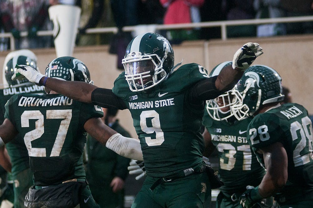 	<p>Senior safety Isaiah Lewis celebrates after a Spartan interception during the game against Michigan on Nov. 2, 2013, at Spartan Stadium. <span class="caps">MSU</span> defeated the Wolverines, 29-6. Danyelle Morrow/The State News</p>
