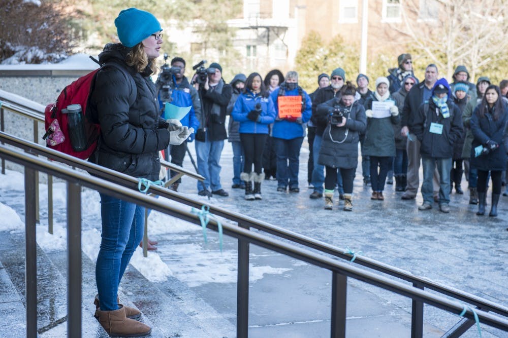 Mathematics junior Laura Mortensen speaks during the MARCH on Hannah on Feb. 6, 2018 outside the Hannah Administration Building. Protesters marched from Erickson Hall to the Hannah Administration Building and had a list of demands, including the resignation of the Board of Trustees and Interim President Engler. (Nic Antaya | The State News)