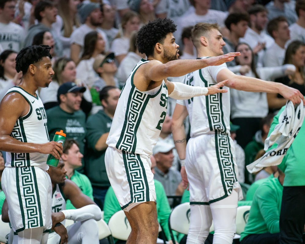 Graduate Student forward Malik Hall (25) cheering with other Spartan players during a game against Rutgers at the Breslin Student Event Center on Jan. 14, 2024. 