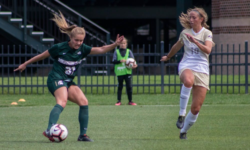 Freshman defender Samantha White (31) dribbles the ball around Colorado midfielder Sarah Kinzner (10) during the game against Colorado University at DeMartin Stadium on Sep. 9, 2018. The Buffaloes defeated the Spartans 3-0.