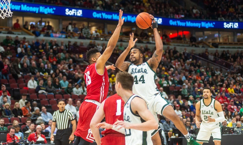 <p>Junior forward Nick Ward (44) shoots the ball against Wisconsin. The Spartans beat the Badgers, 67-55, at the United Center on March 16, 2019.</p>