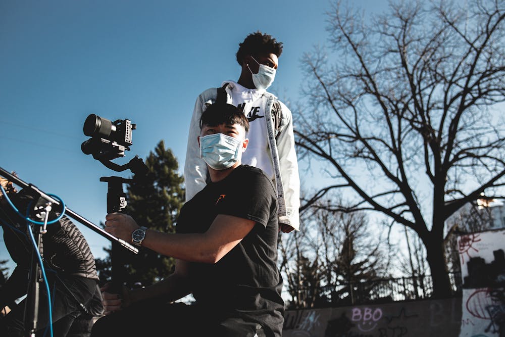 <p>Co-producers of the Comma Concert series, George Pham and Isaiah Johns, film during Conor Lynch&#x27;s live performance at Ranney Skate Park. Photo courtesy of Andrew Herner</p>