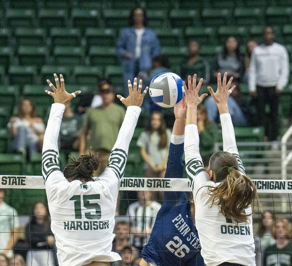 MSU Senior Zora Hardison and Junior Hayley Ogden going to block Penn state graduate student Whitney Lauenstein at the Breslin Center during the MSU v Pennstate Volleyball game In East Lansing, MI on Sunday Sep. 27th, 2026