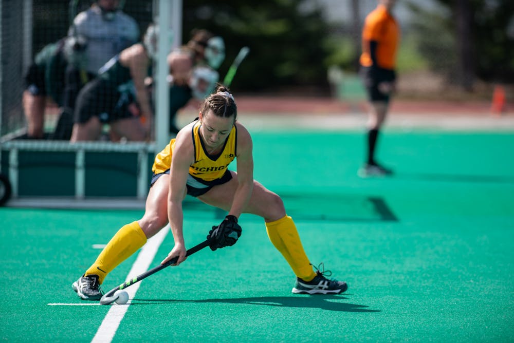 Michigan midfielder Kathryn Peterson takes a penalty corner in an away game against MSU on April 2, 2021.