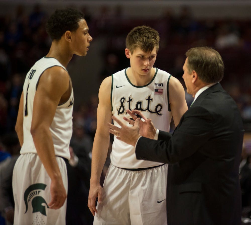 <p>Head coach Tom Izzo talks to senior guard Bryn Forbes, left, and freshman guard Matt McQuaid on Nov. 17, 2015 at United Center in Chicago during the Champions Classic. The Spartans defeated the Jayhawks, 79-73. </p>