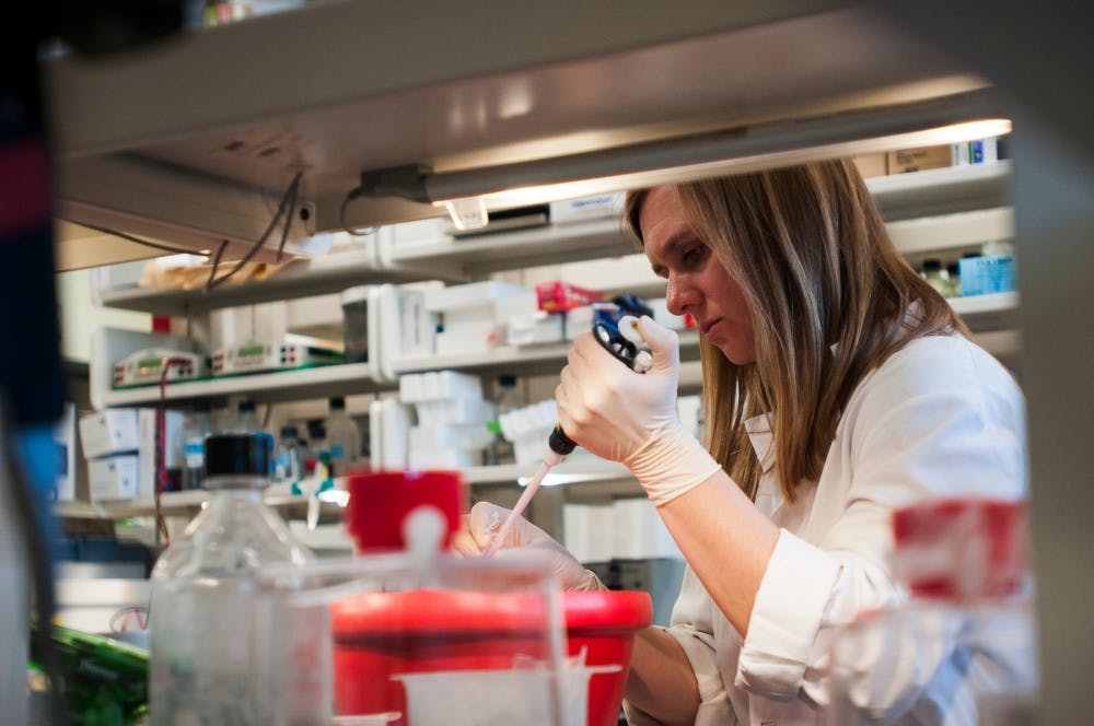 Research associate and post-doctoral fellow Kate Appleton tests the effectiveness of the new compound that the lab has created on Jan. 19, 2017 at the Life Sciences Building. Kate joined the lab for the opportunity to work with Dr. Rick Neubig, Professor and chair of pharmacology and toxicology.