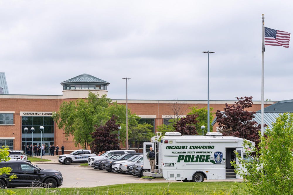Police officers and first responders gather following a "preventative lockdown" at Okemos High School in Okemos, Michigan on May 29, 2025. 