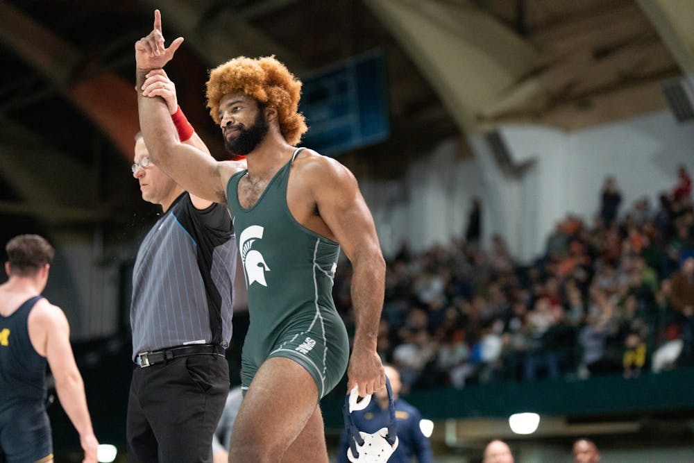 <p>MSU graduate student Cameron Caffey defeats U of M redshirt sophomore Brendin Yatooma to gain 3 points for MSU. The two wrestlers struggled for two tiebreak periods before Caffey’s victory.</p>