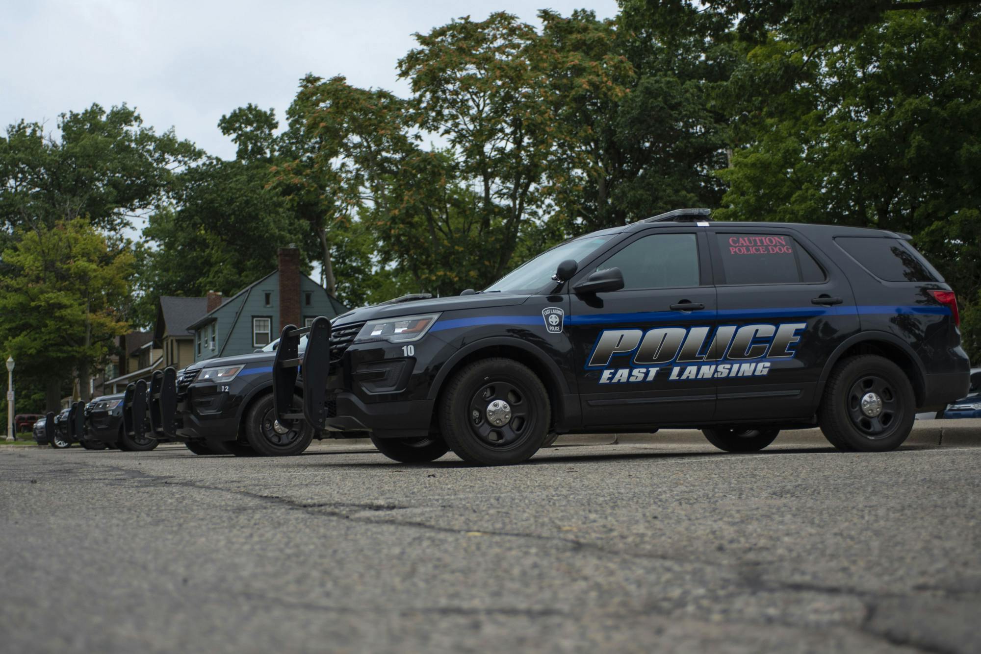 Police cars lined up behind the East Lansing Police Department on September 10, 2020. 