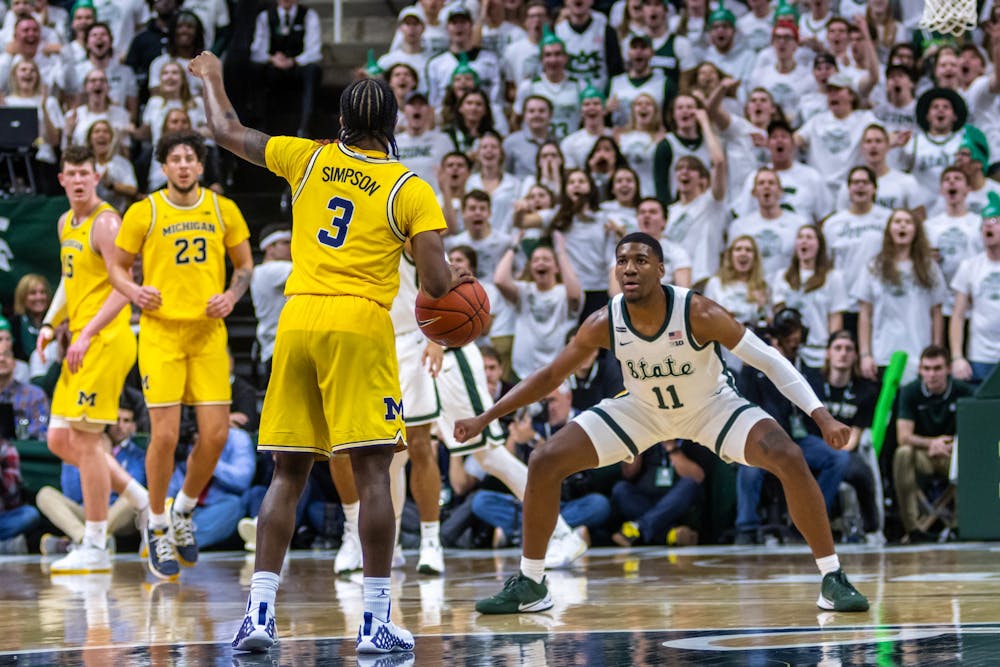 <p>Sophomore forward Aaron Henry (11) defends Michigan guard Zavier Simpson (3). The Spartans defeated Michigan, 87-69, at the Breslin Student Events Center on Jan. 5, 2020. </p>