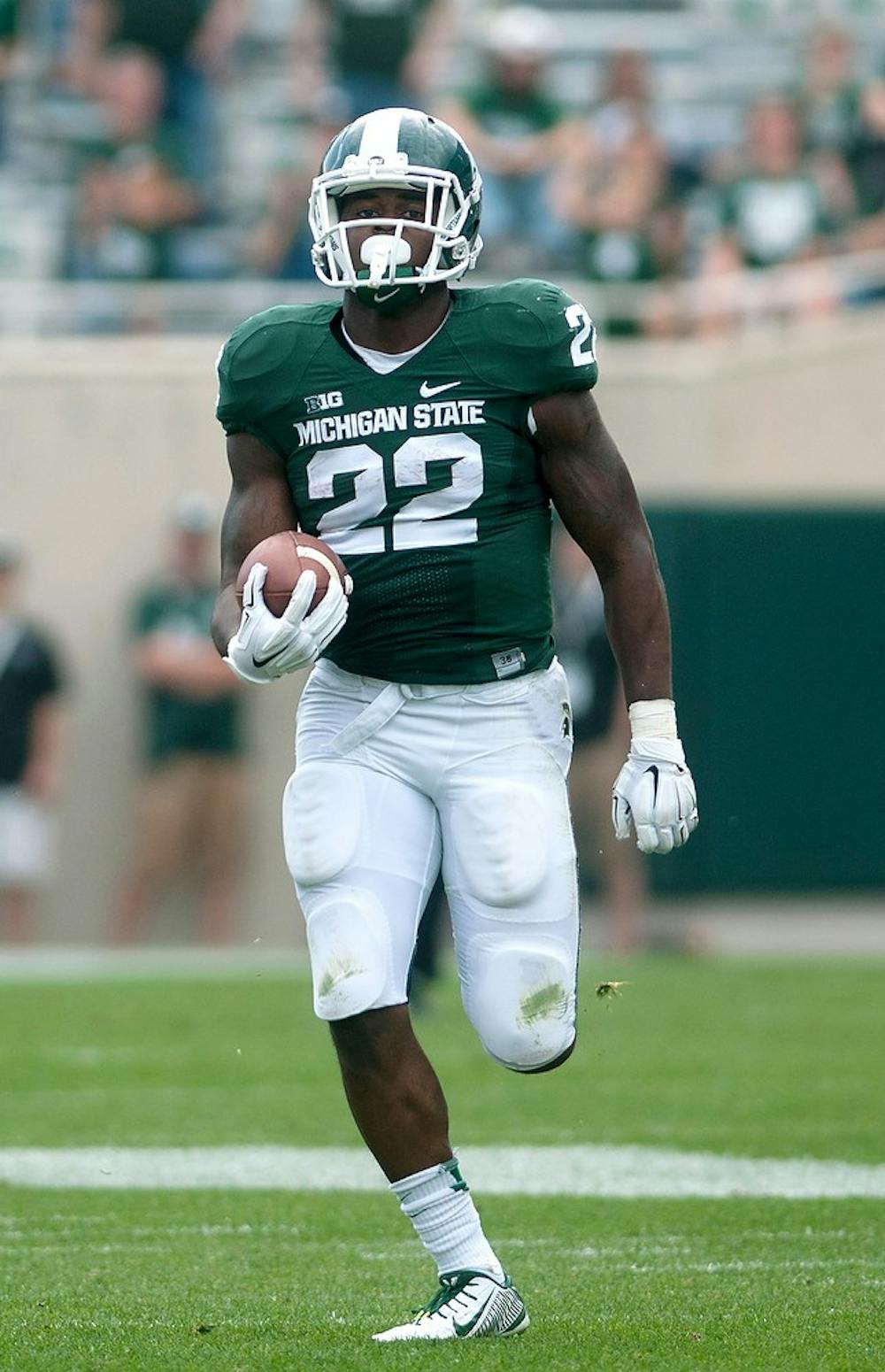 <p>Sophomore running back Delton Williams runs down field to score a touchdown during the game against Eastern Michigan on Sept. 20, 2014, at Spartan Stadium. The Spartans defeated the Eagles, 73-14. Jessalyn Tamez/The State News </p>