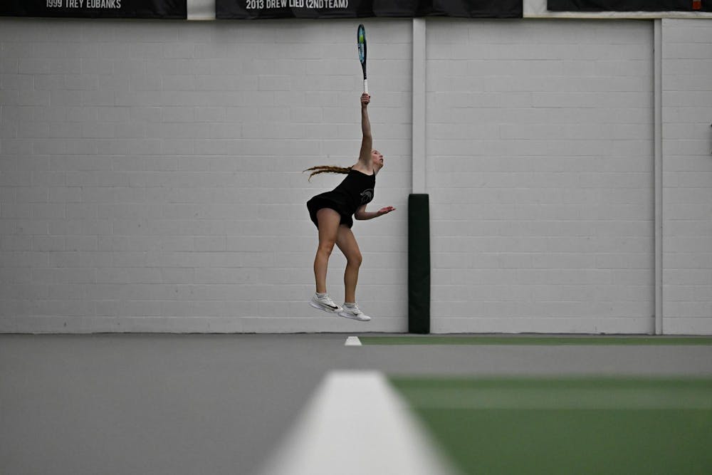 Hanna Tsitavets, a redshirt junior, serves during a singles match at the MSU Tennis Center on Friday, Feb. 6, 2026.