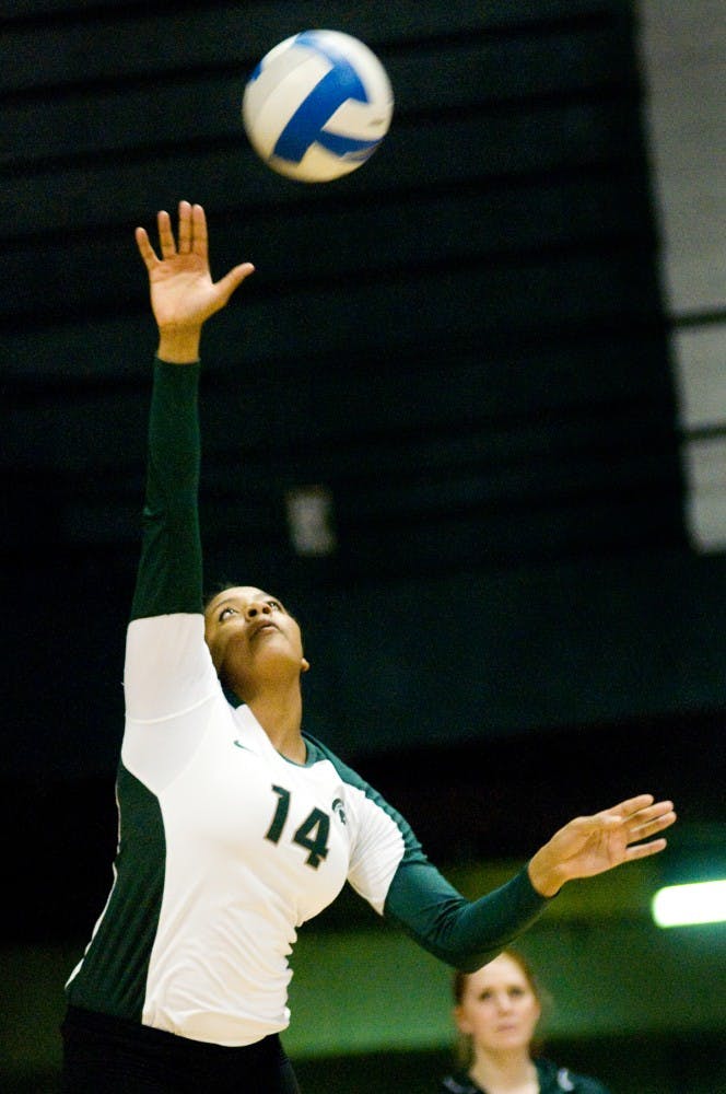 Freshman middle blocker Jazmine White makes a serve Saturday night at Jenison Field House. The Spartans defeated the Wildcats, 3-2. Justin Wan/The State News