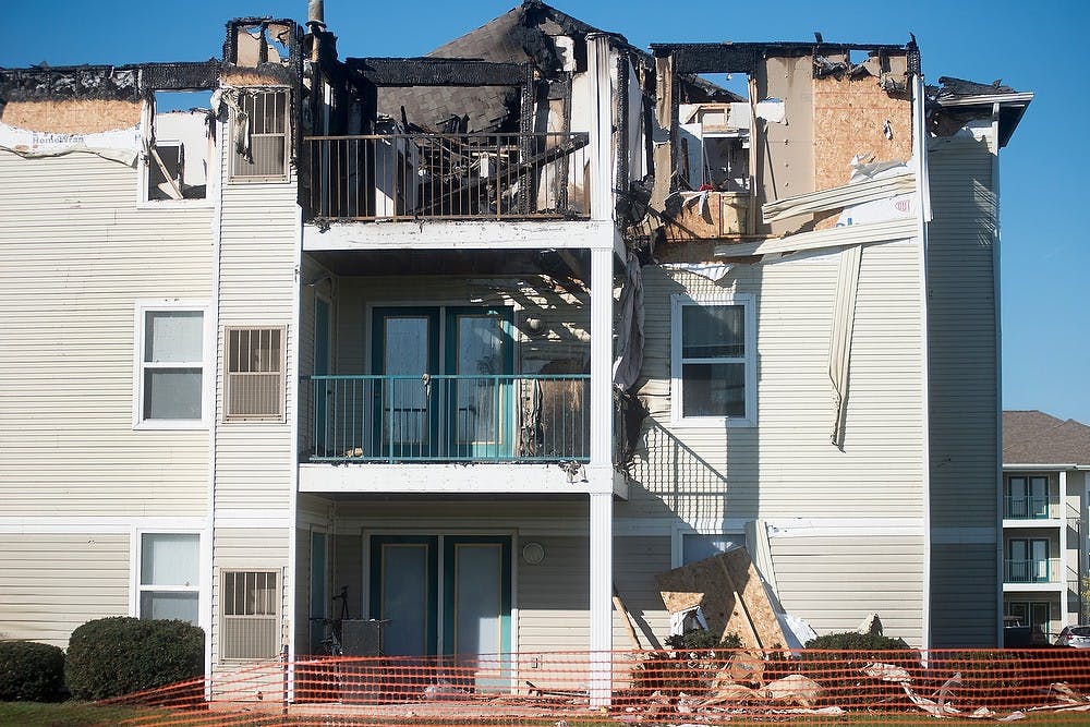 <p>A building is damaged Oct. 7, 2014, after a fire at the Landings at Chandler Crossings on Oct. 5. Julia Nagy/The State News</p>