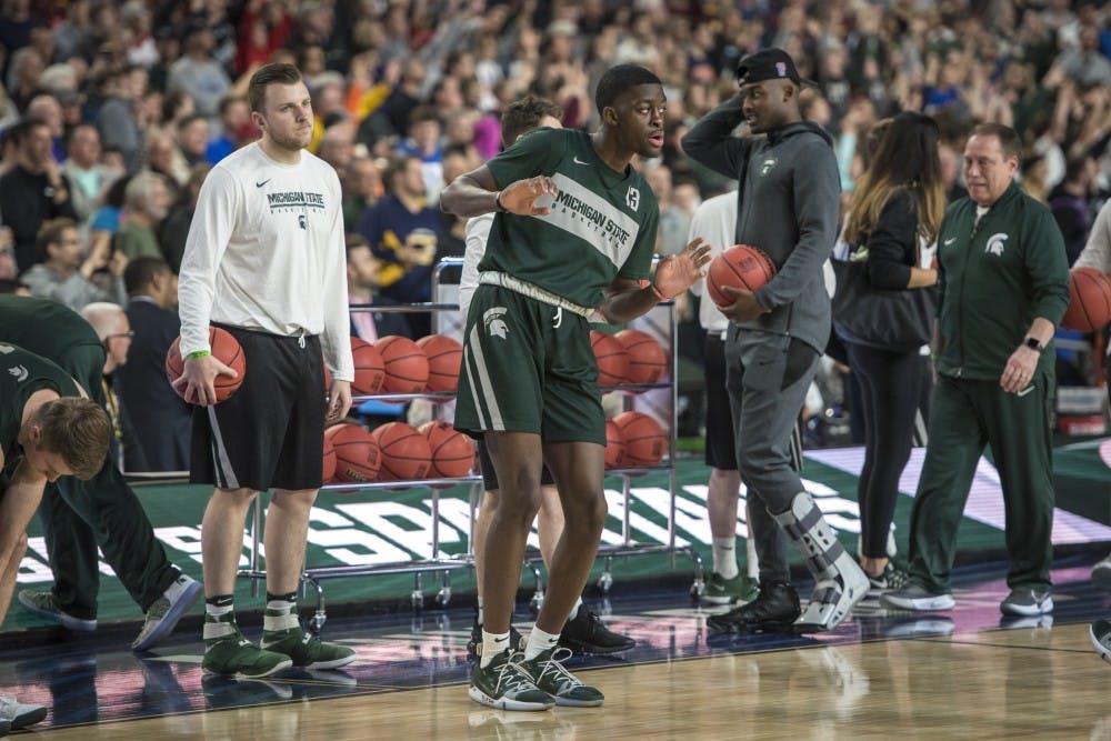 Freshman forward Gabe Brown (13) dances during Michigan State's NCAA Men's Basketball Final Four open practice at U.S. Bank Stadium in Minneapolis on April 5, 2019. (Nic Antaya/The State News)