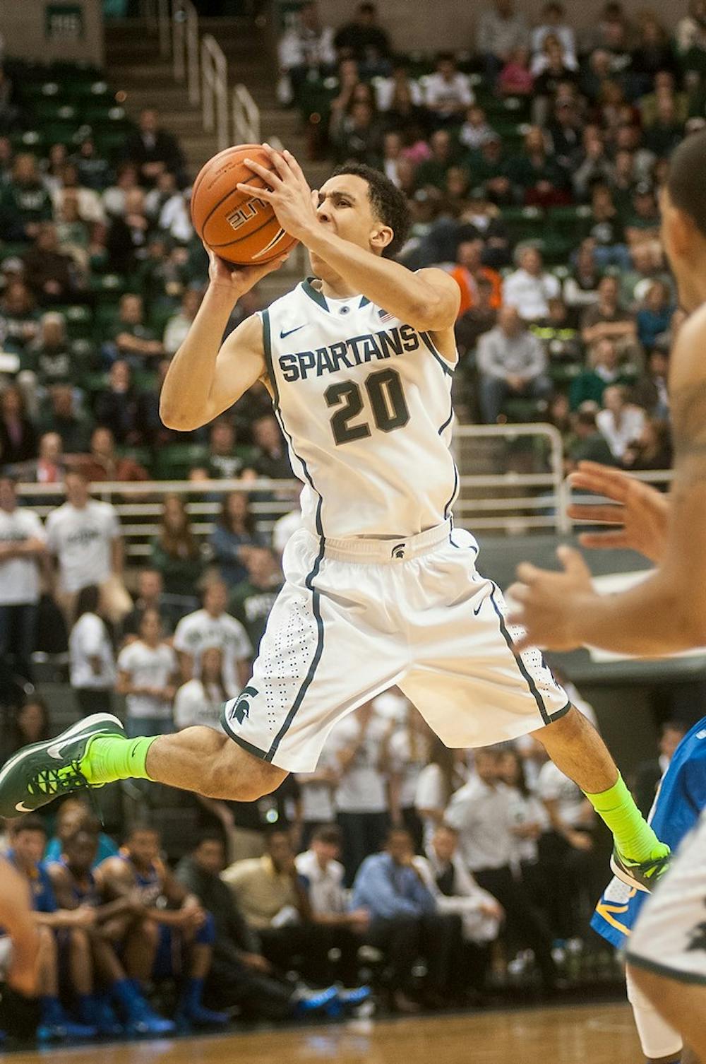 	<p>Junior guard Travis Trice shoots the ball during the game against McNeese State on Nov. 8, 2013, at Breslin Center. The Spartans defeated the Cowboys, 98-56. Khoa Nguyen/The State News</p>