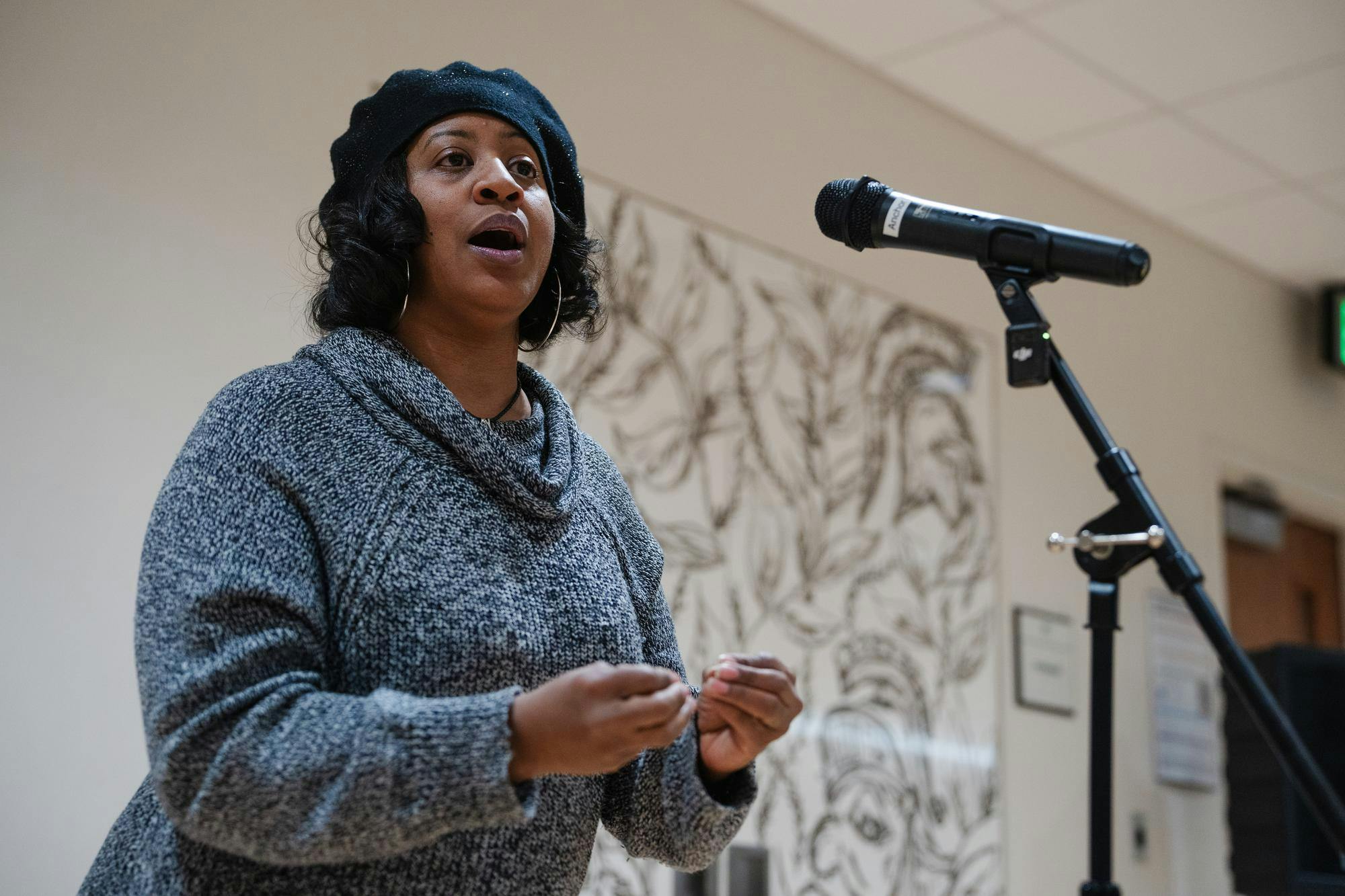 Detroit-based poet Peace Bell reads her poems at the ‘Reclaiming Space Poetry Event’ held in the MSU Union on Feb. 5, 2025. The event included featured performers such as Bell, an open mic portion and the opportunity to add to the reclaiming space art gallery. 