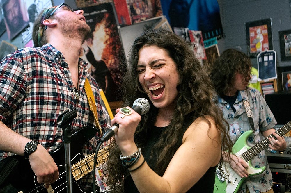 <p>Connor Groscurth, Sonya Major, and Sam Bayoff of The Blue Effect perform with band March 13, 2015, at the Record Lounge, 111 Division Street. The Blue Effect is made up primarily of MSU students and describe their sound as "a well-developed groove-machine". Allyson Telgenhof/The State News.</p>