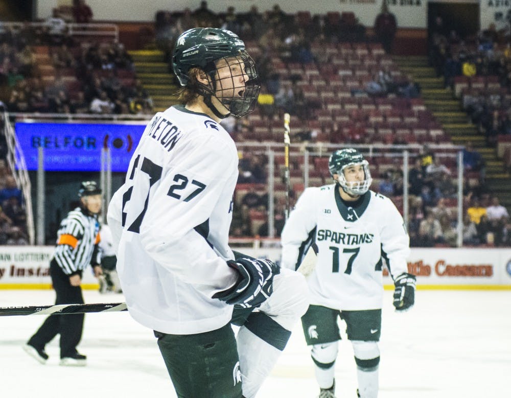 Sophomore wingman Mason Appleton (27) celebrates after scoring a goal during the second period of the 52nd Annual Great Lakes Invitational semifinal game against Western Michigan on Dec. 29, 2016 at Joe Louis Arena in Detroit. The Spartans were defeated by the Broncos, 4-1.