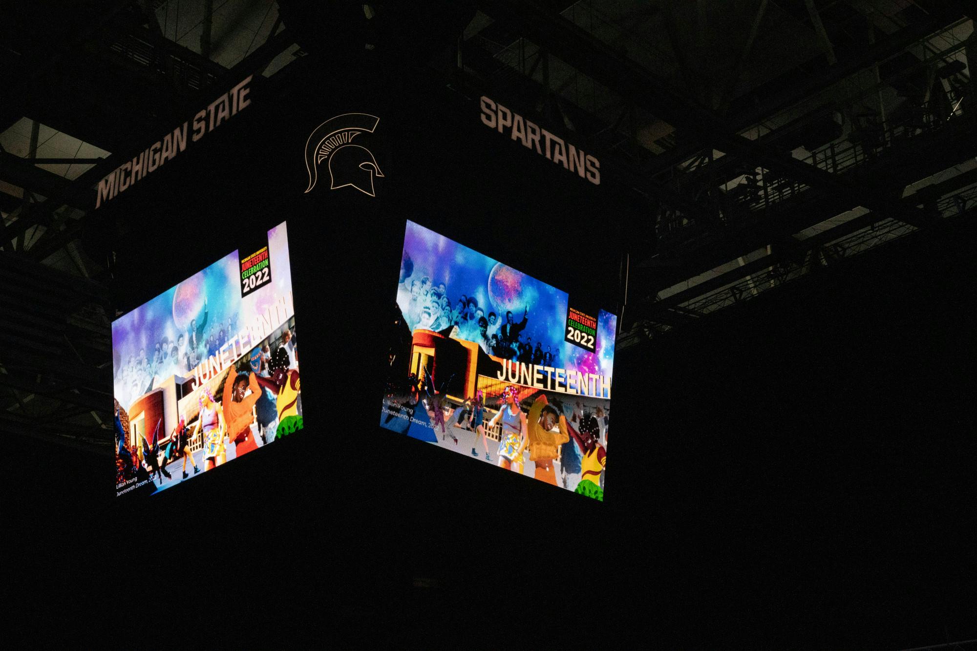 <p>The Jumbotron displays art work during the 2nd Annual Juneteenth celebration at the Breslin Student Events Center on June 17, 2022. </p>