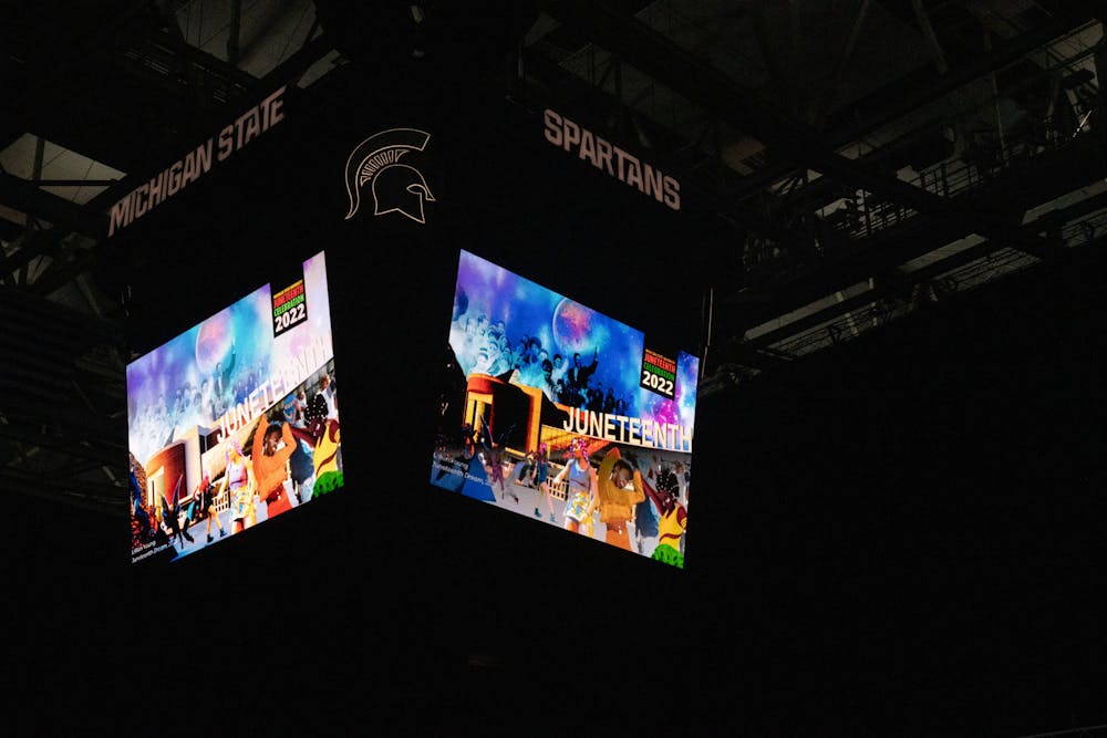<p>The Jumbotron displays art work during the 2nd Annual Juneteenth celebration at the Breslin Student Events Center on June 17, 2022. </p>