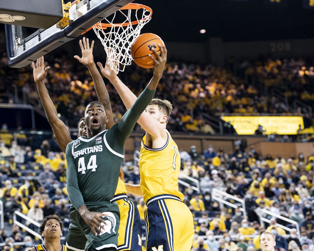 <p>Senior forward Gabe Brown shoots the ball at the game against Michigan at the Crisler Center on March 1, 2022. The Spartans lost to the Wolverines 87-70. </p>