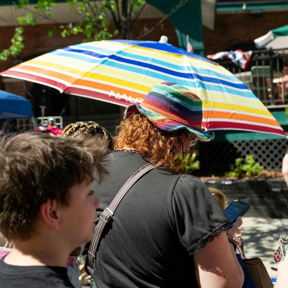 <p>A person wearing a rainbow hat purchases a keychain from a stand during the East Lansing Pride celebration in East Lansing, Mich., on June 13, 2026.</p>