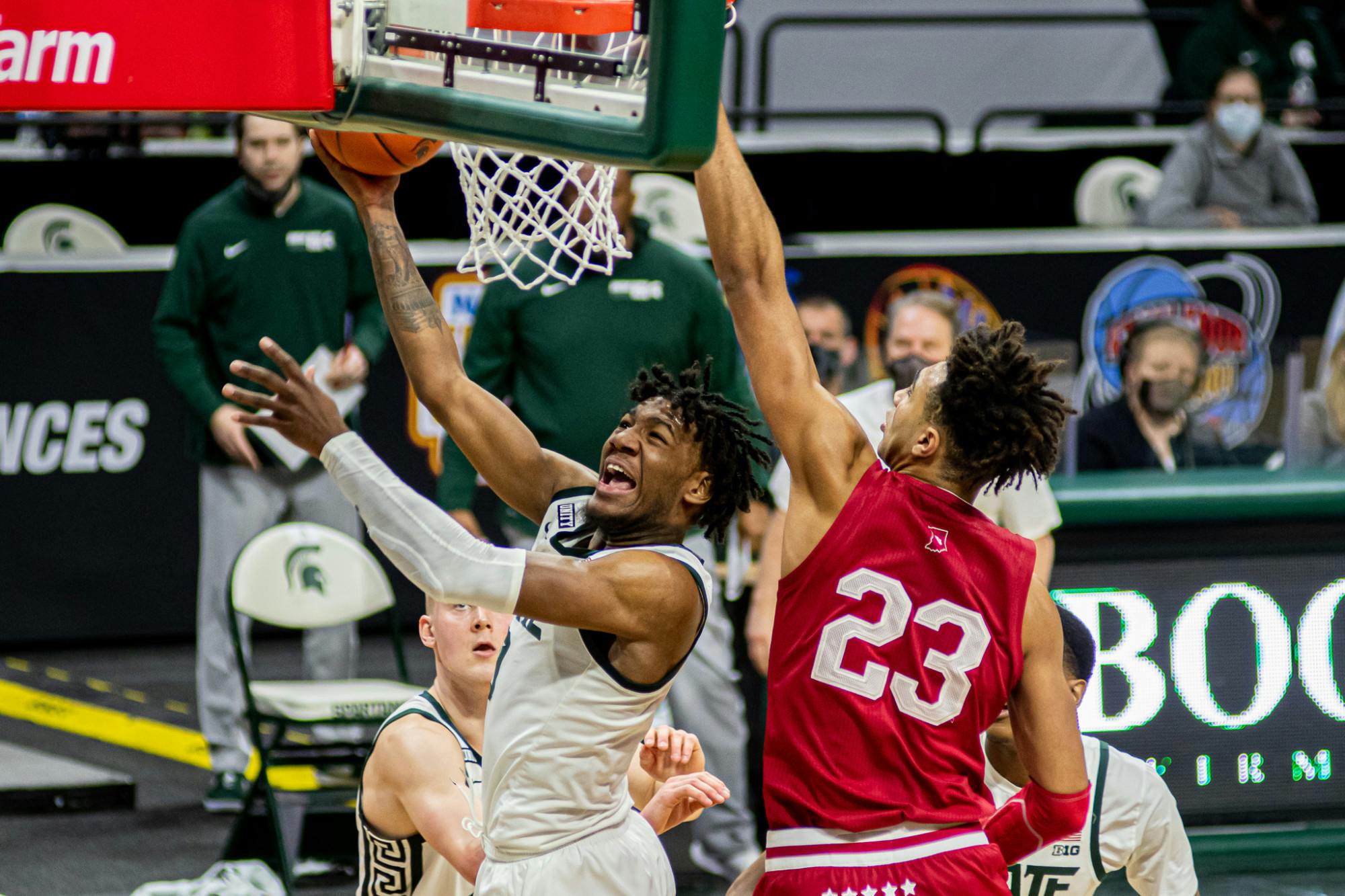 <p>Junior guard Aaron Henry shoots a contested layup on March 2, 2021. Henry had an all-around performance with 22 points, eight rebounds and five assists in the Spartan victory against the Hoosiers.</p>