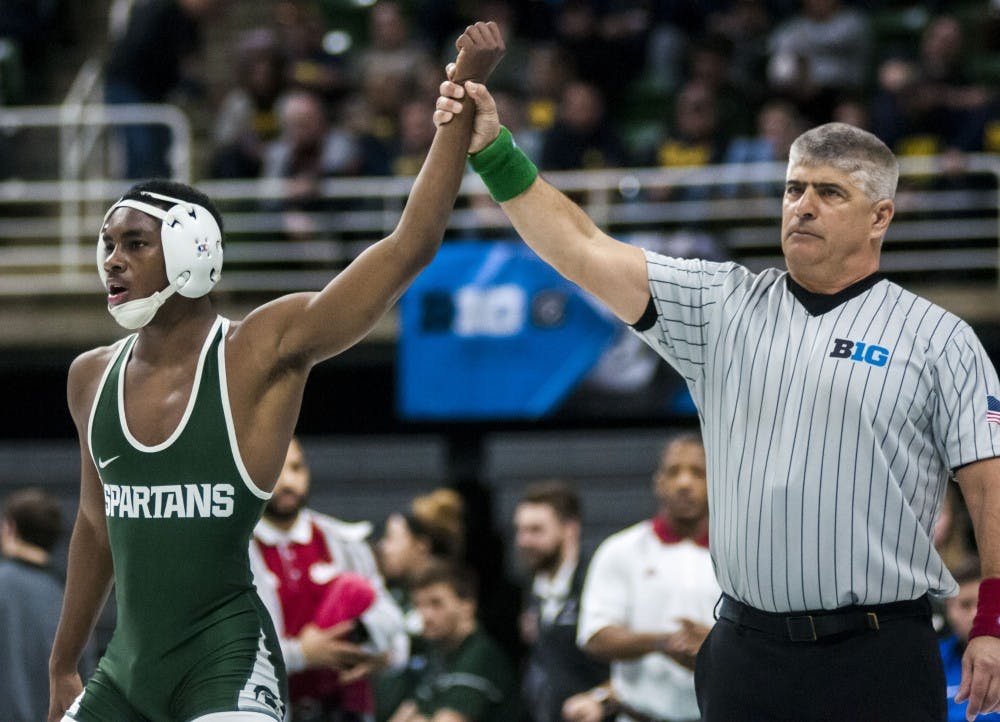 Freshman RayVon Foley wrestled with Indiana junior Elijah Oliver on March 3, 2018 at Breslin Center during session one of the Big Ten Wrestling Championship. Foley defeated Oliver, 14-3. (Annie Barker | State News)