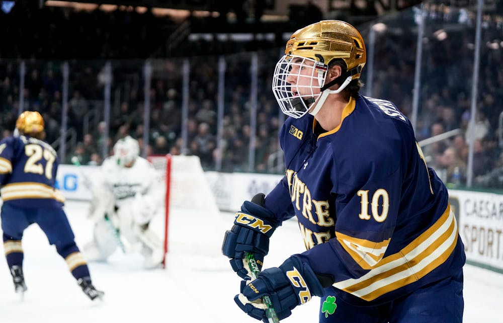 <p>Notre Dame's sophomore forward Hunter Strand (10) watches the puck during a game against MSU at Munn Ice Arena on Feb. 3, 2023. The Spartans defeated the Fighting Irish 3-0.</p>