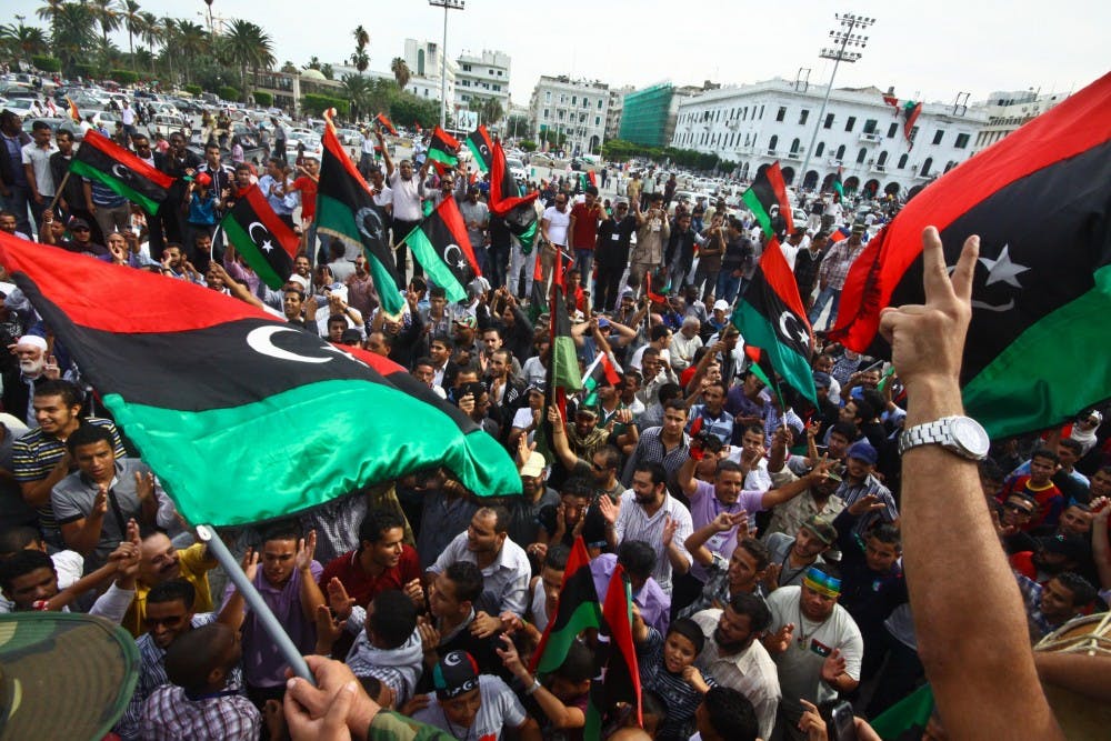 Libyan people celebrate the death of the Libyan fallen leader Muammar Gaddafi in Tripoli, Libya, October 20, 2011. Mahmoud Jibril, head of the Libyan National Transitional Council&apos;s executive committee, confirmed Thursday that former Libyan leader Muammar Gaddafi was killed in gun battle in his hometown Sirte. (Amru Salahuddien/Xinhua/Zuma Press/MCT)