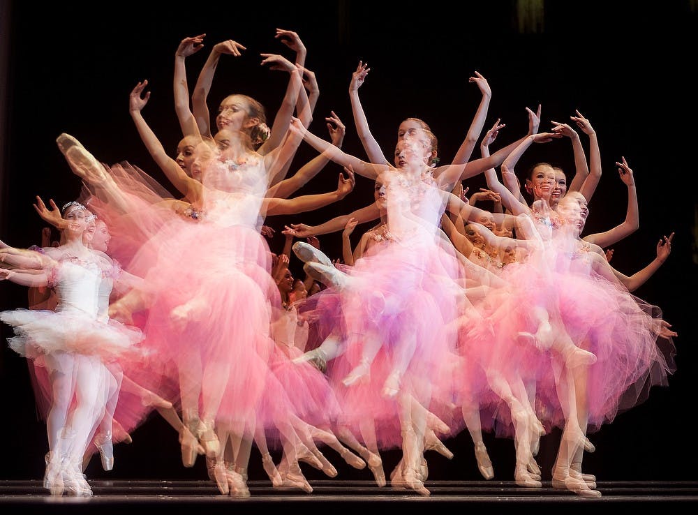 	<p>In this photo taken with multiple exposure technique, ballet dancers spin on the stage Wednesday, Nov. 21, 2012, during the rehearsal of &#8220;The Nutcracker&#8221; at Wharton Center. Justin Wan/The State News</p>