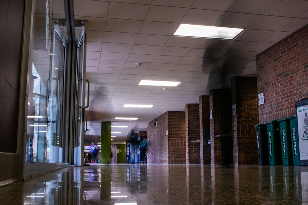 <p>People walk through Wells Hall after MSU canceled classes due to coronavirus March 11, 2020.</p>