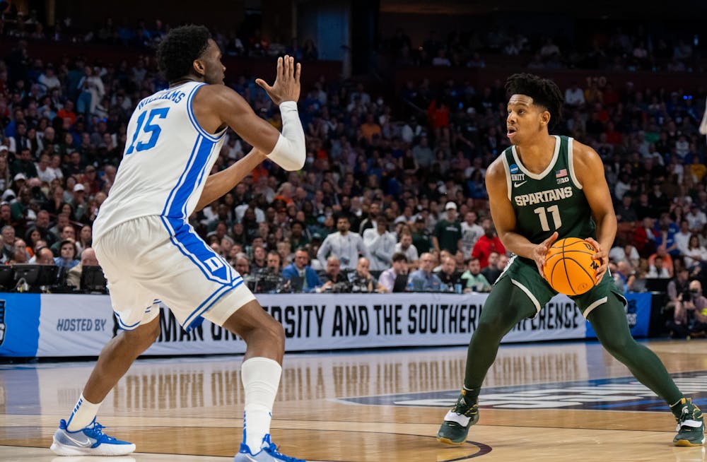 <p>Sophomore center Mark Williams (15) defends against sophomore guard A.J. Hoggard (11) during Duke&#x27;s victory over Michigan State on March 20, 2022.</p>